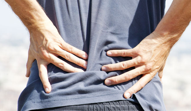 sciatic man hands on lower back pain