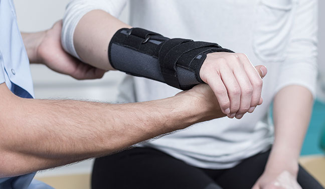 wrist splint being installed and checked on a patient