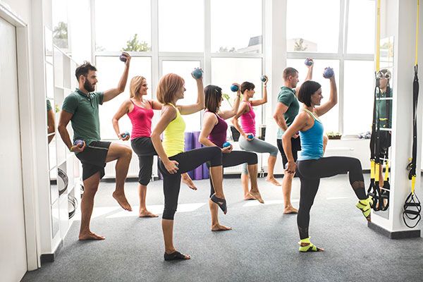 Exercise class with weights and legs up