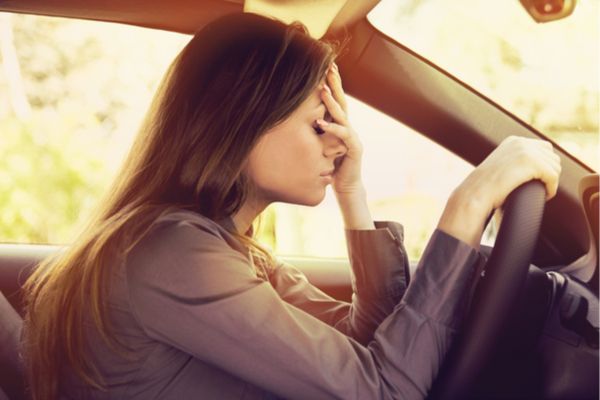 A woman feeling anxious while driving