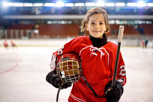 young girl in a hockey rink