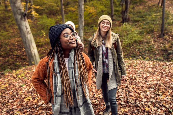 Three women hiking outside 