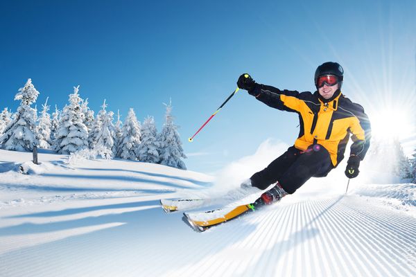 A man skiing on a sunny day