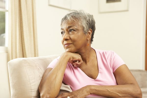 A woman looking thoughtful in the distance 