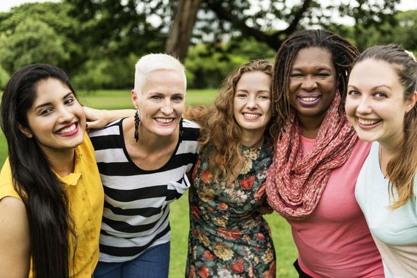 A group of women outside smiling