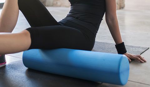 using a foam roller to release myofascial tension on self