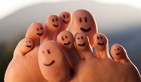 toes with happy faces drawn on them