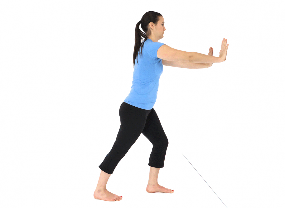 A woman doing a calf stretch