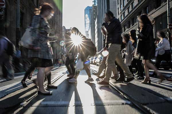 people walking on a crowded cross walk